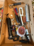 Box of assorted screw drivers, grease guns, sanding pads,