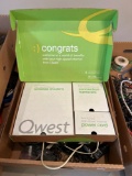 Qwest wifi router, assorted electric cords