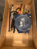 Box of assorted tools, ratchet, socket holder, rubber strap, band saw blade