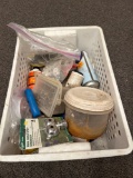 Plastic crate with aerosol cans sprinkler tips, brake fluid, assorted screws