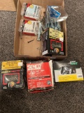 Box of assorted screws, fasteners, and nails