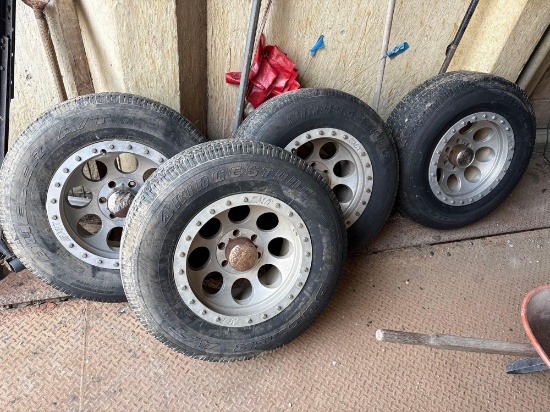 4 - Bridgestone P265/70R17 tires and MT 6 hole rims and Lugnuts
