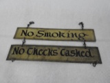 No Smoking and No Checks Cashed Signs