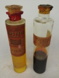 Pair of Macmillan Oil Sample Jars