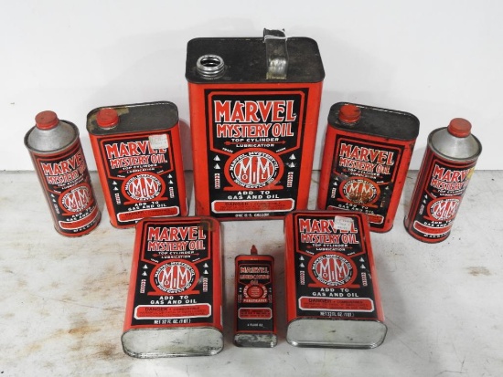 Group of Eight Marvel Mystery Oil Cans