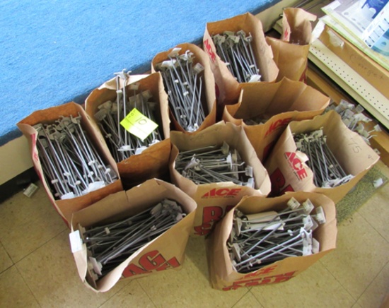10 bags of peg board display hooks & a pile on floor