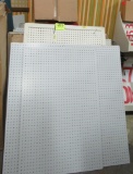 Several sheets of pegboard