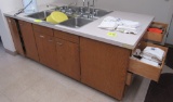 island with lower cbinets and pair of 3-compartment sinks