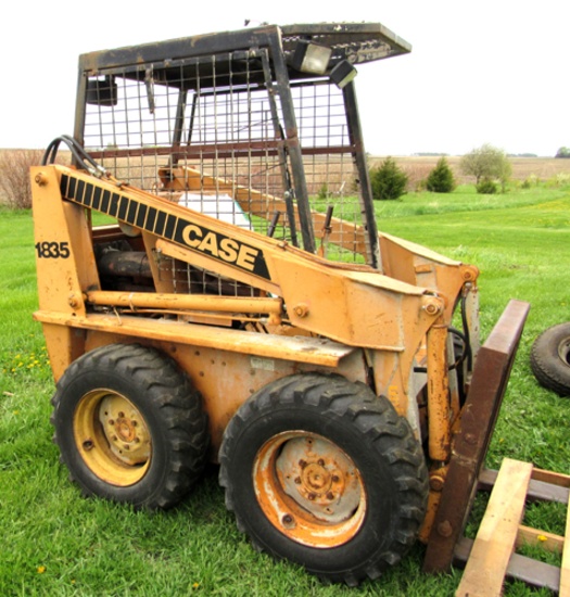 Case 1835 skid loader with forks & bucket