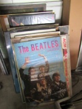 Pile of framed posters