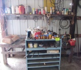 Blue shelf, wooden work bench and  miscellaneous contents