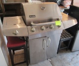 Aussie gas grill, small table and bar stool