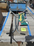 seed spreader, sprinkler, golf clubs