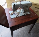 sewing machine in cabinet