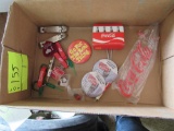 box of various Coca-Cola promotional items