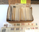 box full of individually sleeved 1st day issues