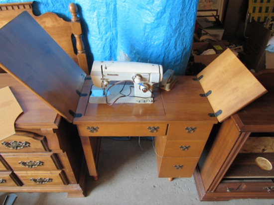 Domestic sewing machine in cabinet