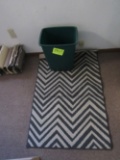 rug and trash can
