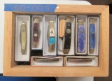 8 knives in wooden display box