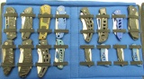 16 knives in blue cloth display
