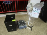 eye chart, fan, overhead projector and file cabinet