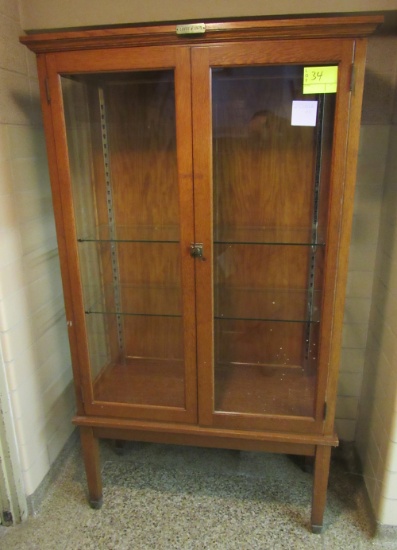 glass front display case with Class of 1929 badge