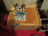 phone, chess set, money jar and wooden chest