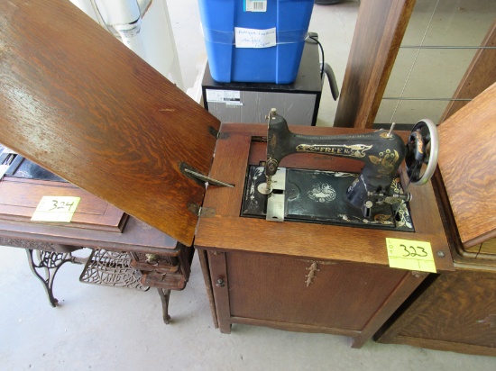 The Free #5 sewing machine and cabinet