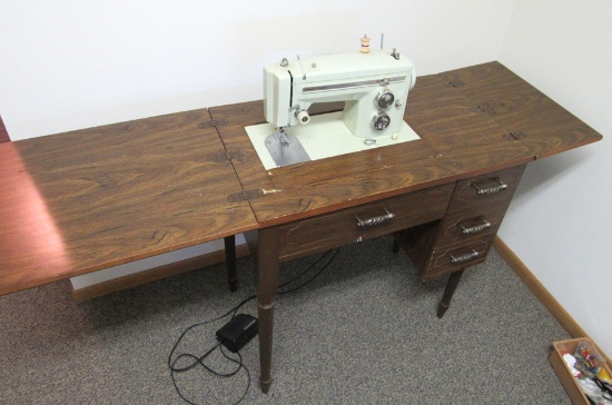 Sears Kenmore sewing machine in cabinet