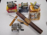 antique fishing reels w/ boxes, gun cleaning rod, filet knife