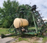 Cultivator with tank