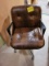 brown leather rolling chair