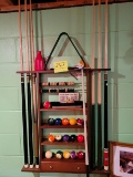 pool rack with balls, ques, chalk, brush
