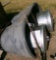 water tub, metal trash cans, old vise