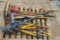 pallet of yard tools, ice auger, hose brush