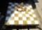 antique chess board, box of tiny figures