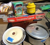 alarm clock, train set, electric lamp, metal pan, ceramic bowl