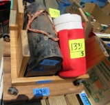 lunch box, thermos, metal tables, wooden cart
