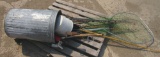 garbage can full of fishing gear