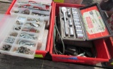 a lot of misc tools, screws, bits, socket set, drill bit set, extension cord