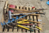 pallet of yard tools, ice auger, hose brush