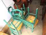 6 green wooden chairs