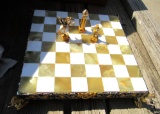 antique chess board, box of tiny figures