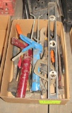 cock guns, level, clamps, saws, axe, misc tools