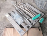 pallet of yard tools, live trap