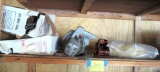 shelf of wire, skill saw, jack, and tarp