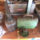 antique lunchbox, oil can, and antique metal containers