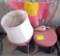 2 pink chairs, flower rug, lamp