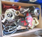 extension cords, fire extinguishers, brass hose nozzles, small solar panels, red reflectors