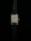 Vintage Timex Gold Tone Square Shaped Women's Watch with Black Band